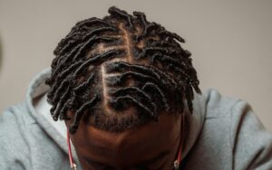 man with comb coils starter locs