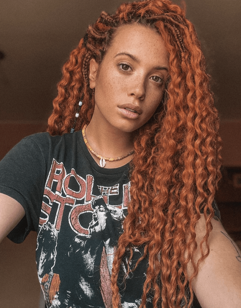 beautiful girl with copper curly braids