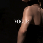 the opening when starting the vogue app, a model dressed in black and gold walking the runway