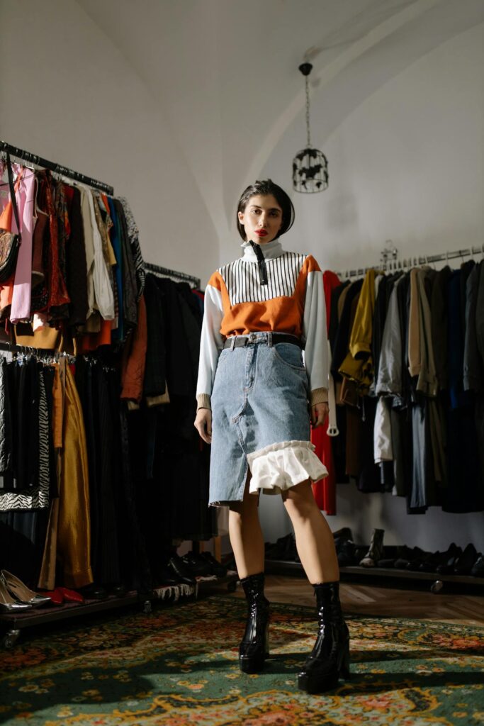 girl in a thrift store with a unique outfit on