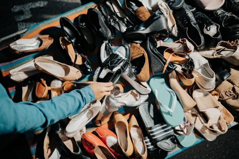 pile of used shoes at thrift store